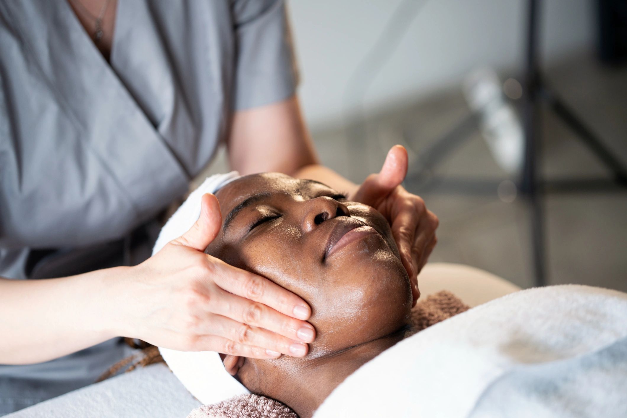 Professional facial massage treatment in a calm spa setting